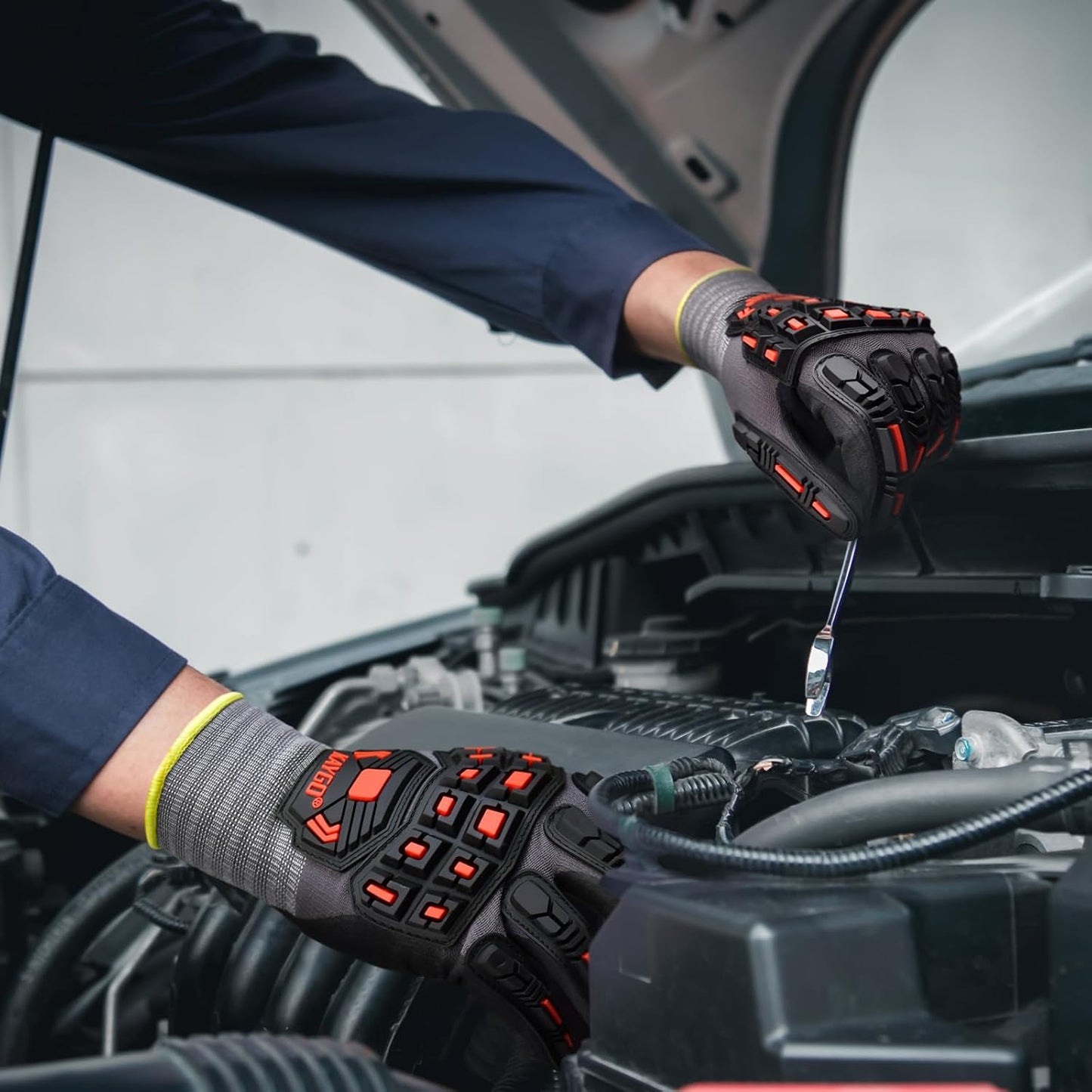 Close-up of gloved hand gripping a wrench, demonstrating strong grip and dexterity while working with tools.