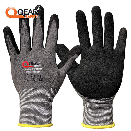 Dexterous QearSafety 15-gauge touchscreen-compatible safety gloves with sandy nitrile grip for wet and oily applications.